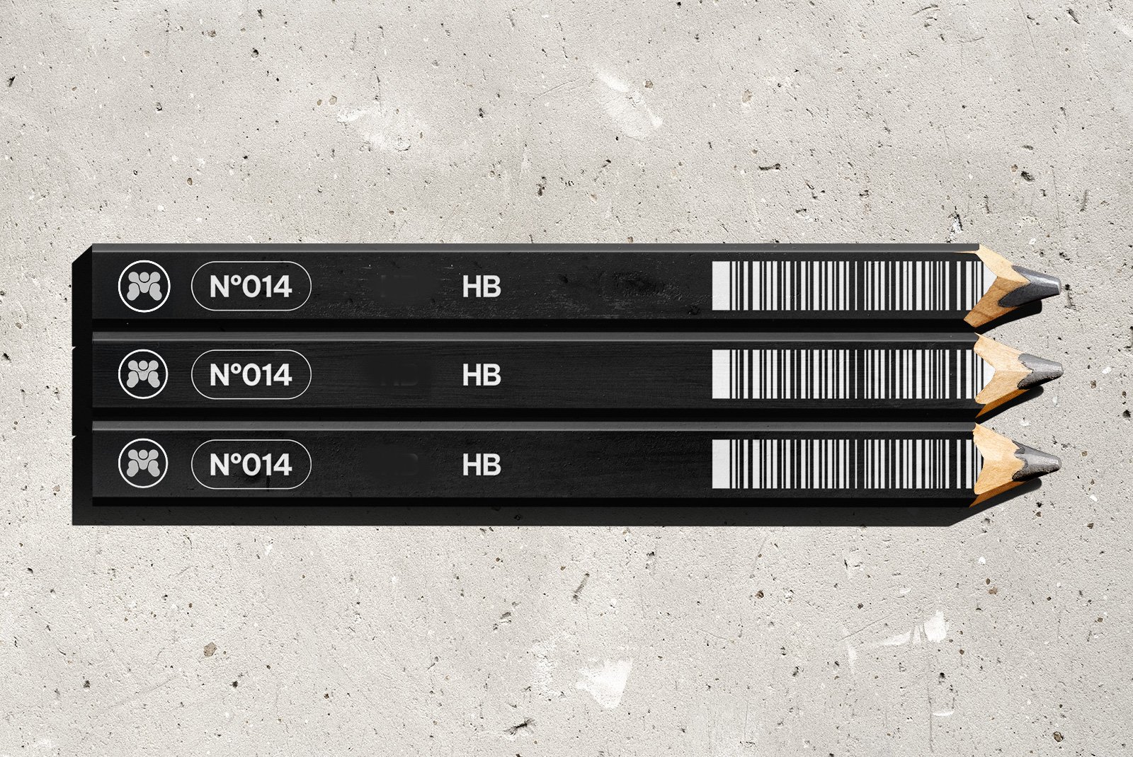 Three black pencils with white markings and barcodes, placed parallel on a concrete surface. Each pencil has a sharpened tip and features the model number 'N°014' and the grade 'HB'.